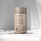 A beige cylindrical container labelled "L-Thea nine, 60 x 400 mg capsules" by Augment Life sits on a softly lit Gray background, exuding a calm, minimalist vibe.
